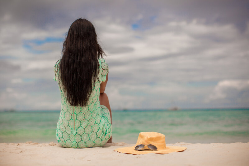 Woman Sitting on Beach — Green
