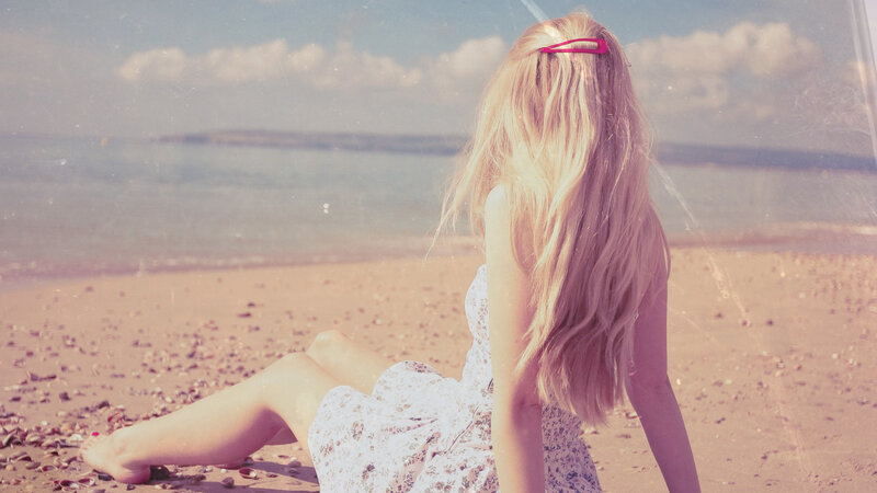 Woman Sitting on Beach — Pink, Serene, Afternoon, Photograph