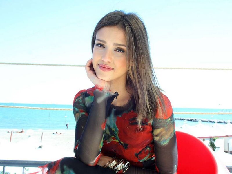 Woman Sitting on Beach — Red