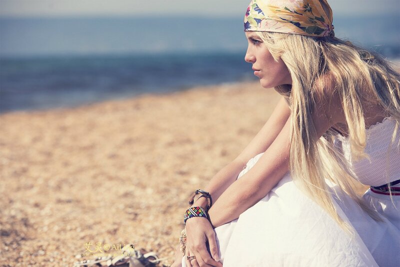 Woman Sitting on Beach — White, Serene, Afternoon, Photograph