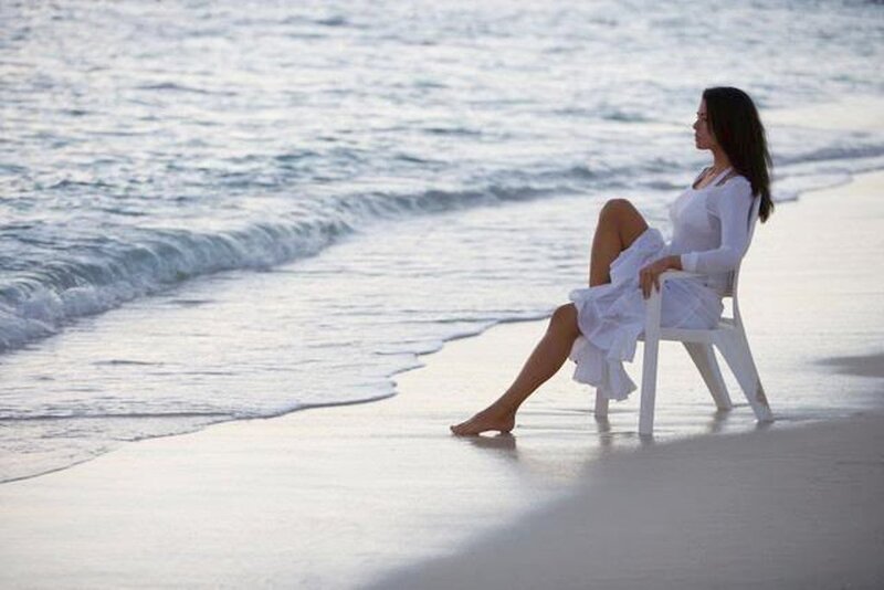 Woman Sitting on Beach — White, Serene