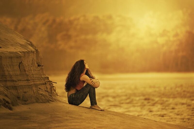 Woman Sitting on Beach — Yellow