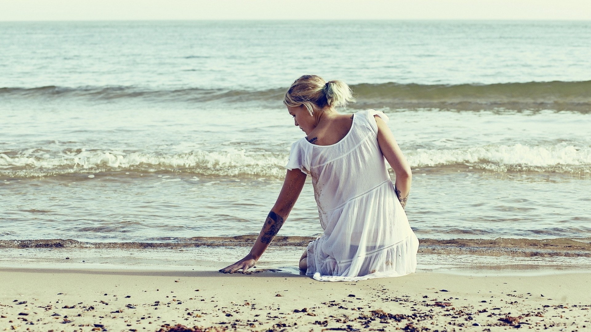 woman sitting on beach