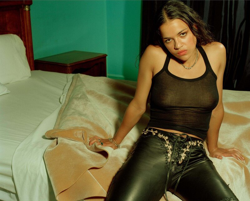 Woman Sitting on Bed — Black, Confident, Photograph, Nightstand