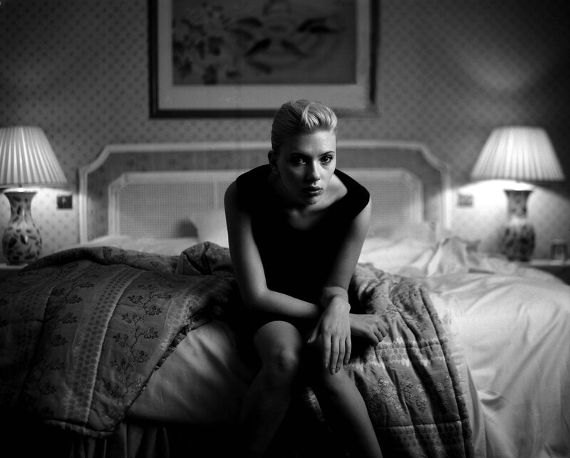 Woman Sitting on Bed — Black, Dramatic, Night, Photograph, Lamp, Quilt