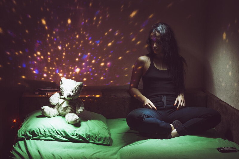 Woman Sitting on Bed — Green, Dark