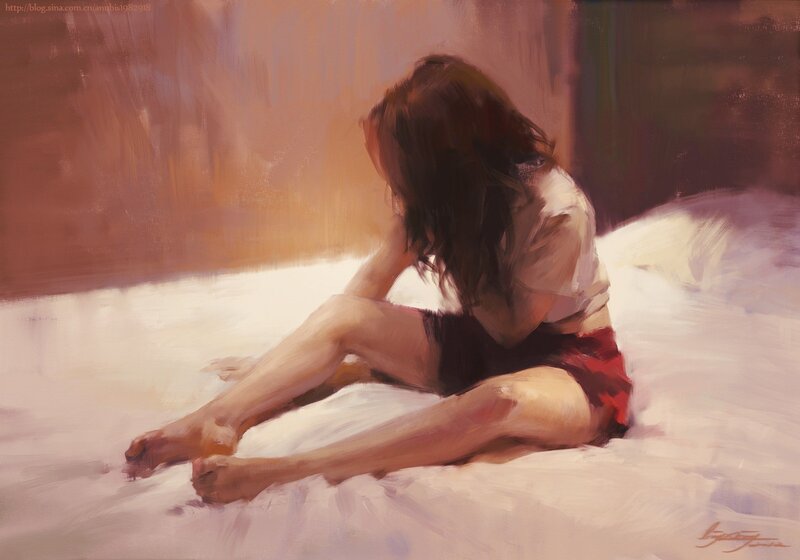 woman sitting on bed painting