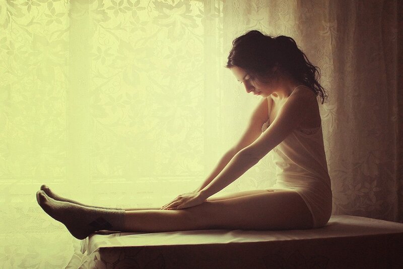 Woman Sitting on Bed — Yellow, Serene
