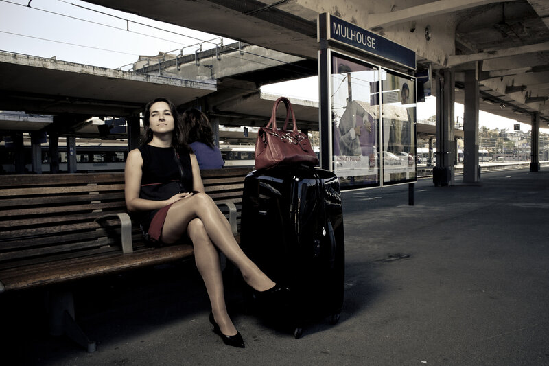 Woman Sitting on Bench — Black, Calm, Afternoon, Photograph, Suitcase