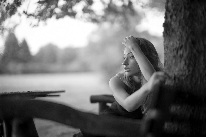 Woman Sitting on Bench — Black, Contemplative, Afternoon, Photograph