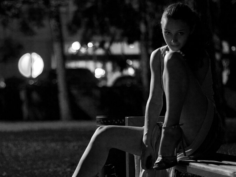Woman Sitting on Bench — Black, Dramatic, Night, Photograph