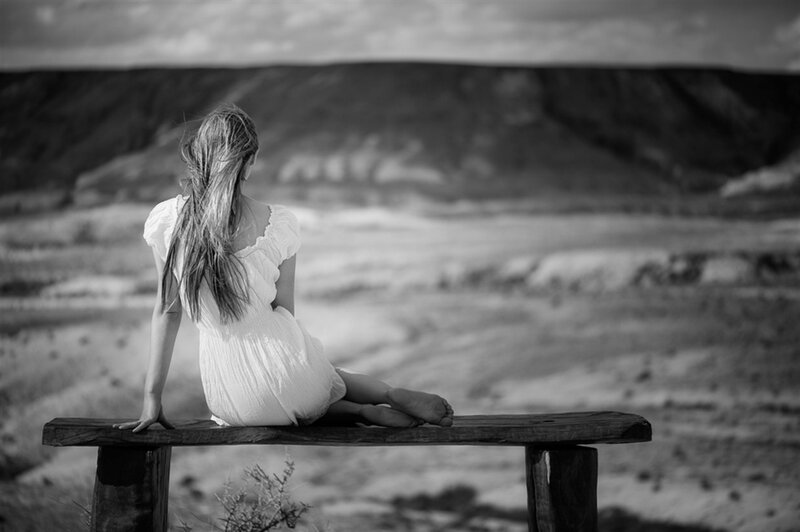 Woman Sitting on Bench — Black, Serene
