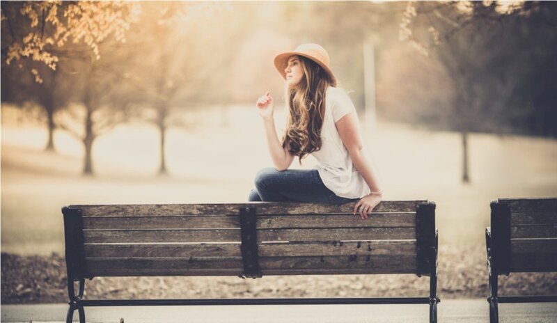 Woman Sitting on Bench — Brown, Serene, Sunset
