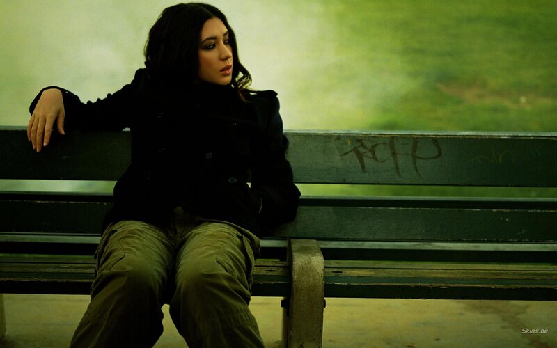 Woman Sitting on Bench — Green, Melancholic, Photograph, Graffiti