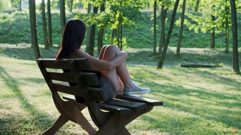 Woman Sitting on Bench — Green, Serene, Afternoon, Photograph