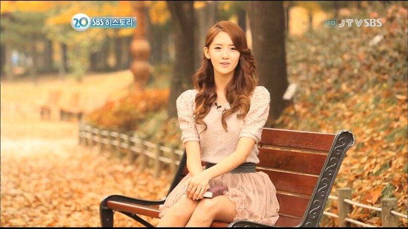 woman sitting on bench in autumn