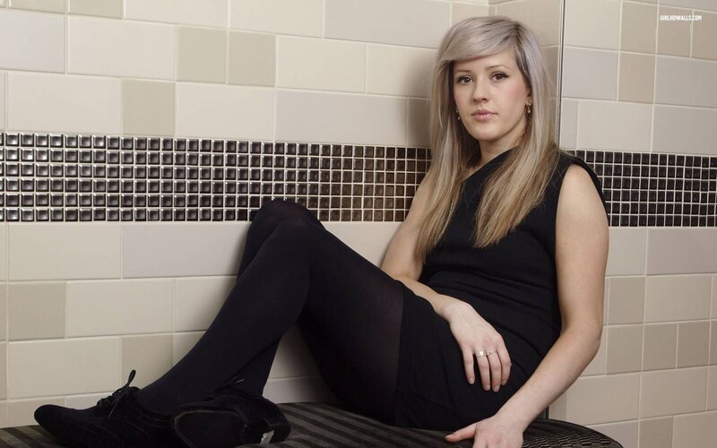 woman sitting on bench in tiled room