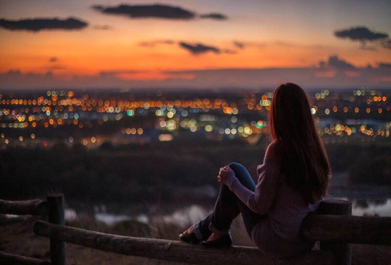 Woman Sitting on Bench — Orange, Serene, Sunset