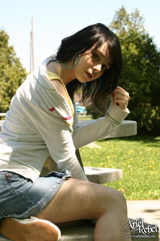 woman sitting on bench outdoors