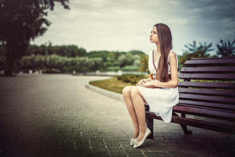 Woman Sitting on Bench — White, Contemplative