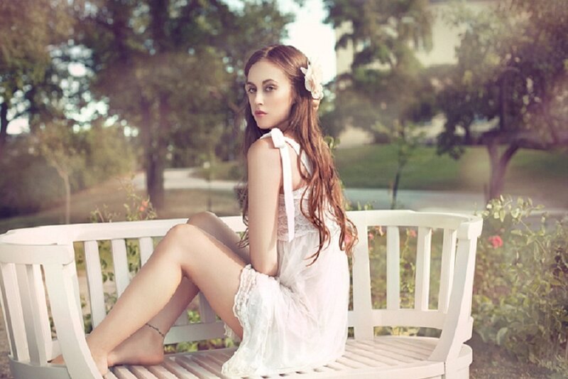 Woman Sitting on Bench — White, Serene