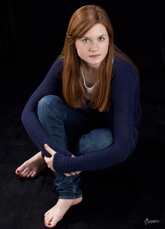 woman sitting on black background