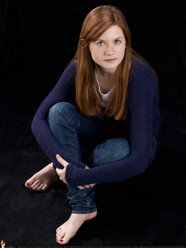 woman sitting on black background