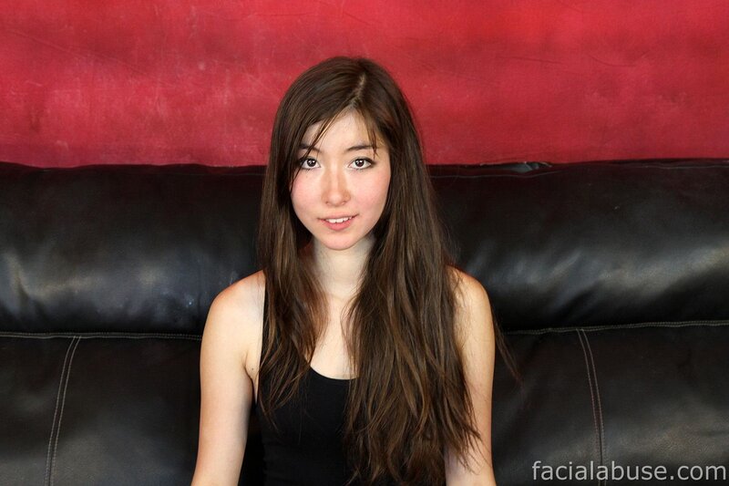 woman sitting on black couch