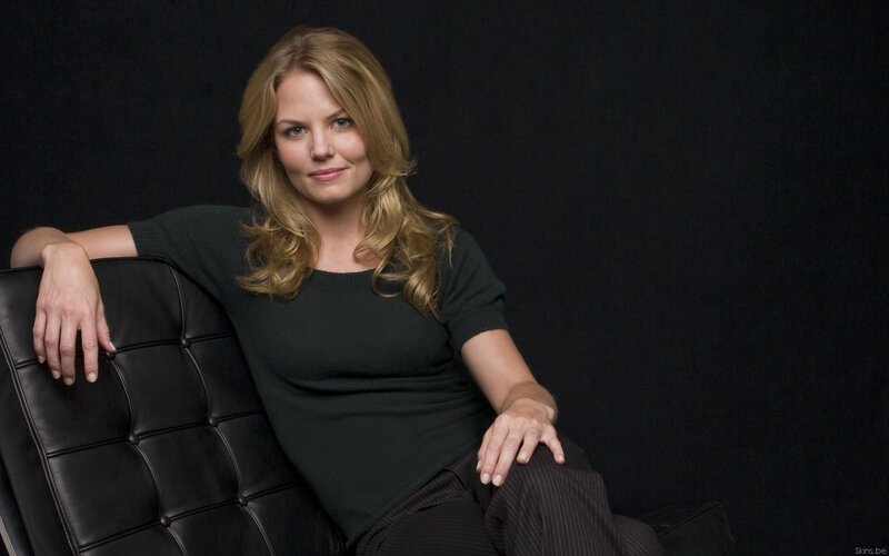 woman sitting on black leather chair