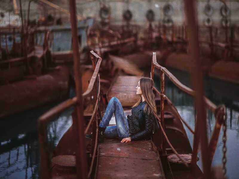 Woman Sitting on Boat — Brown