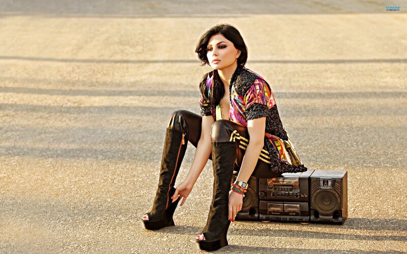 woman sitting on boombox
