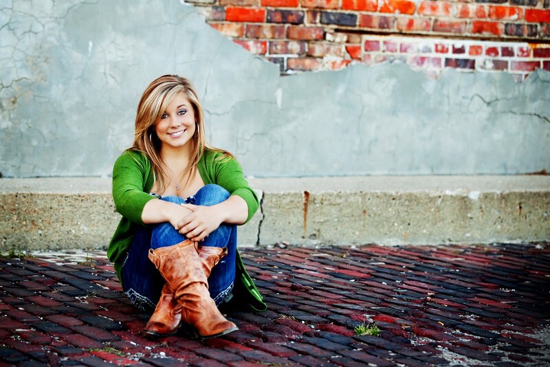 woman sitting on brick ground