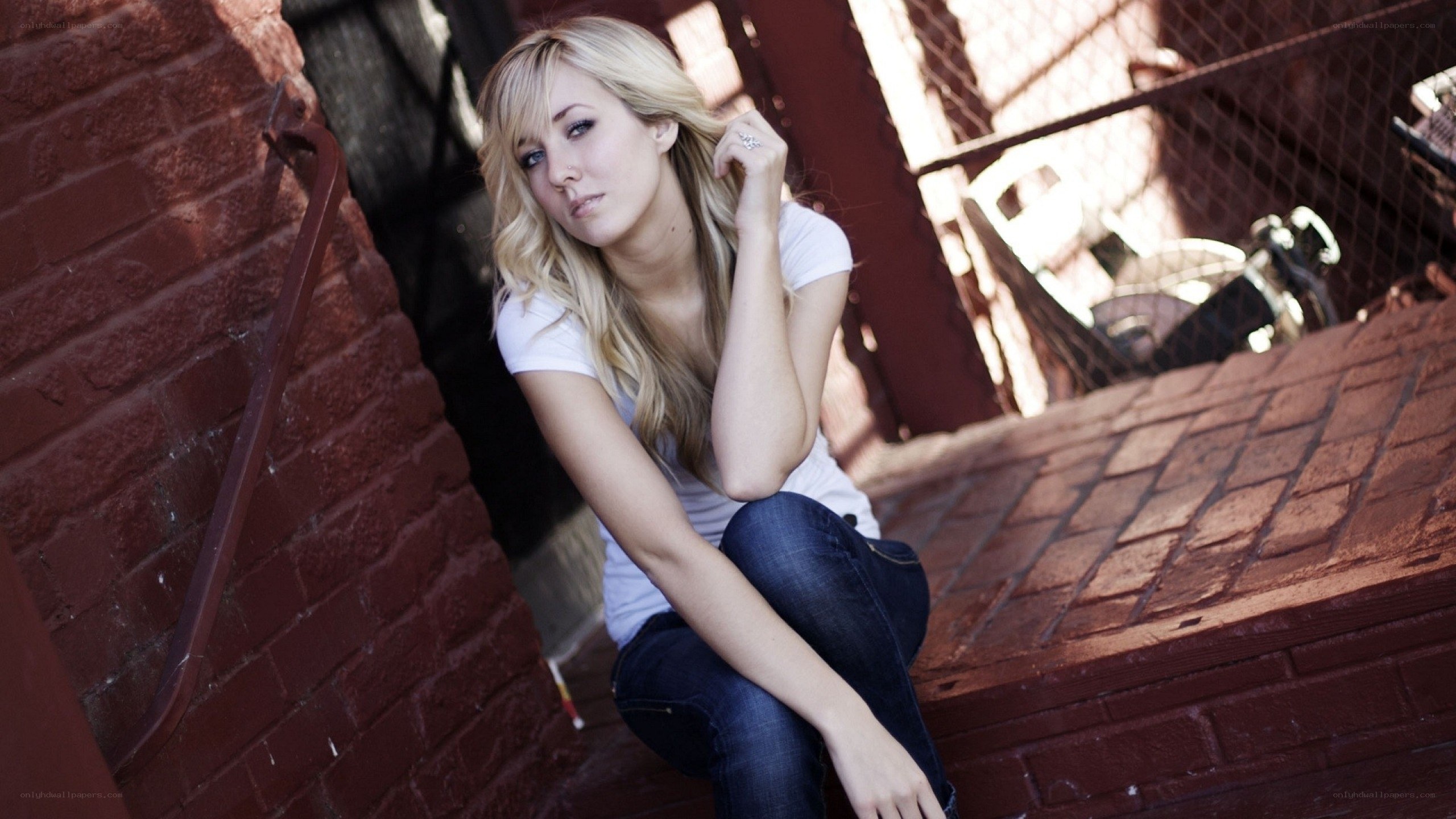 woman sitting on brick steps