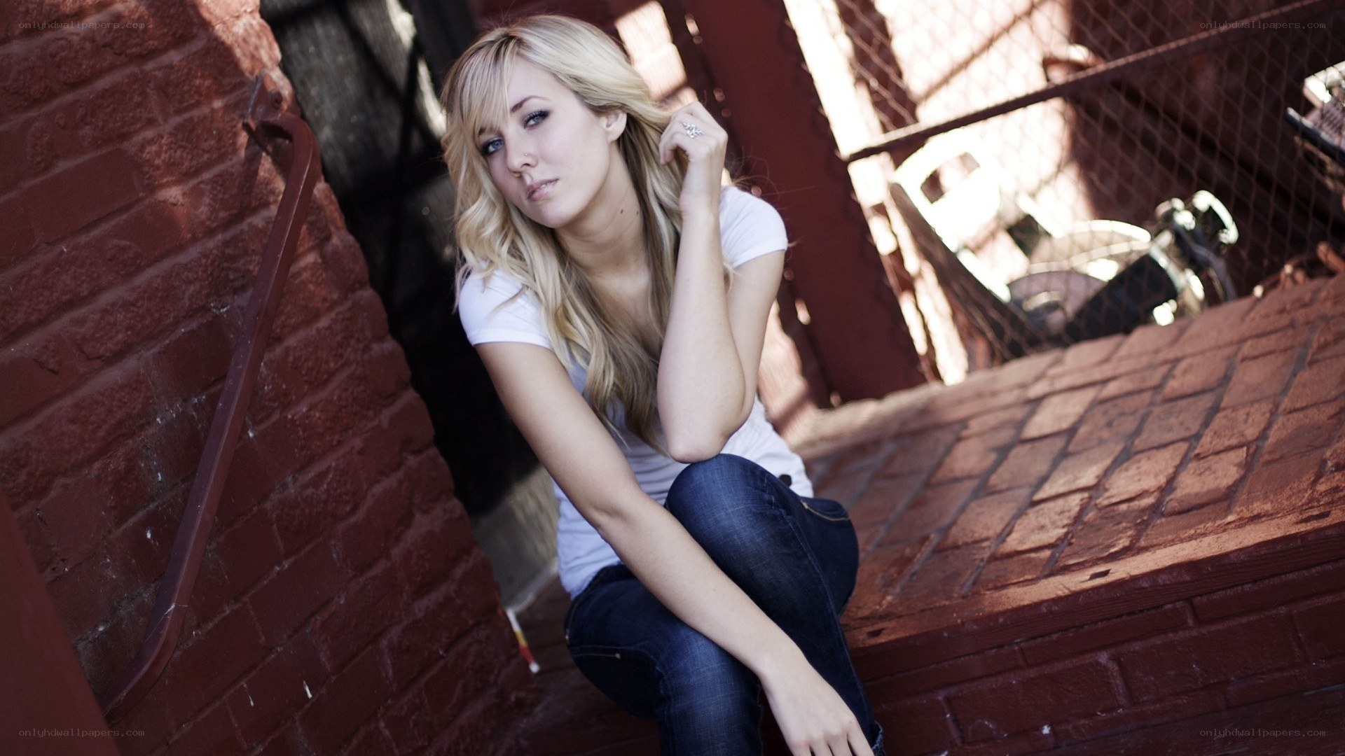 woman sitting on brick steps