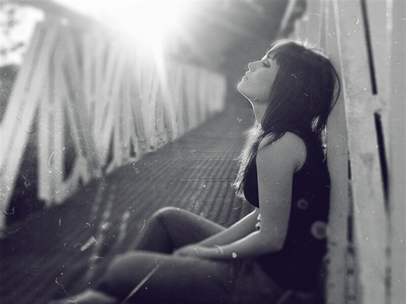 Woman Sitting on Bridge — Black
