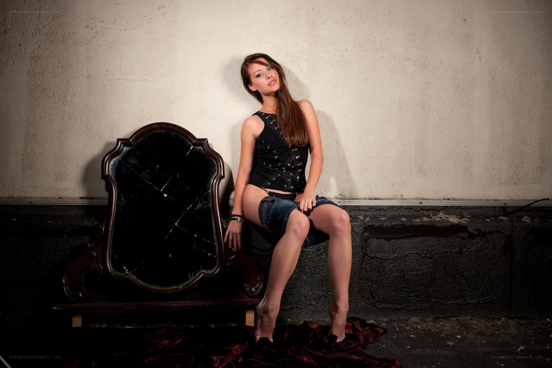 woman sitting on broken mirror