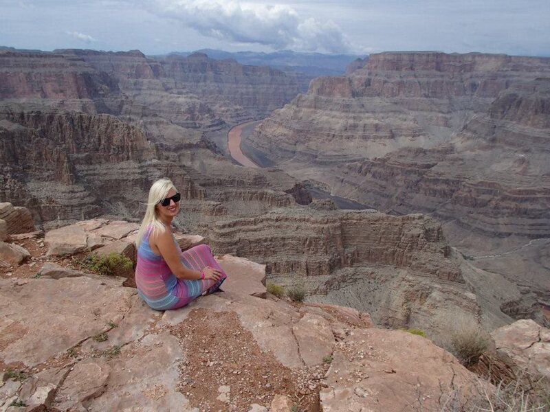 Woman Sitting on Canyon Edge