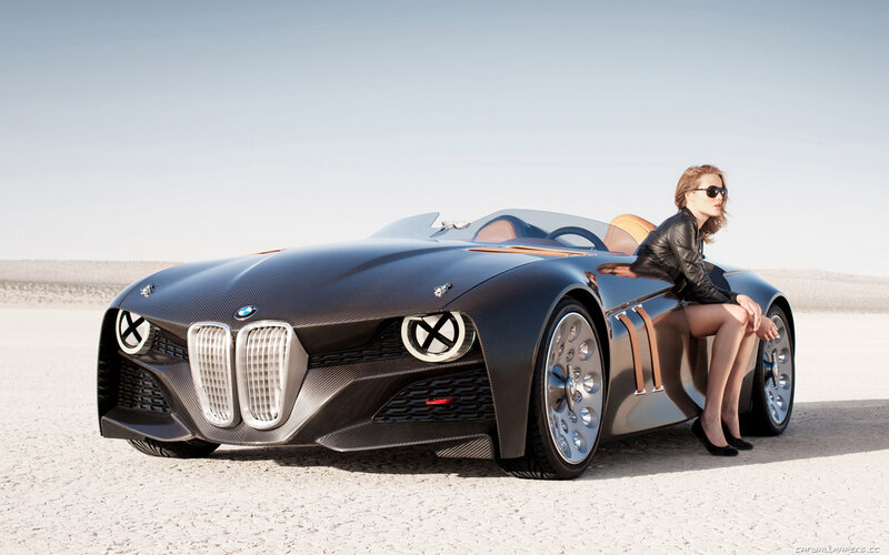 Woman Sitting on Car — Black, Serene, Afternoon, Photograph, Sunglasses