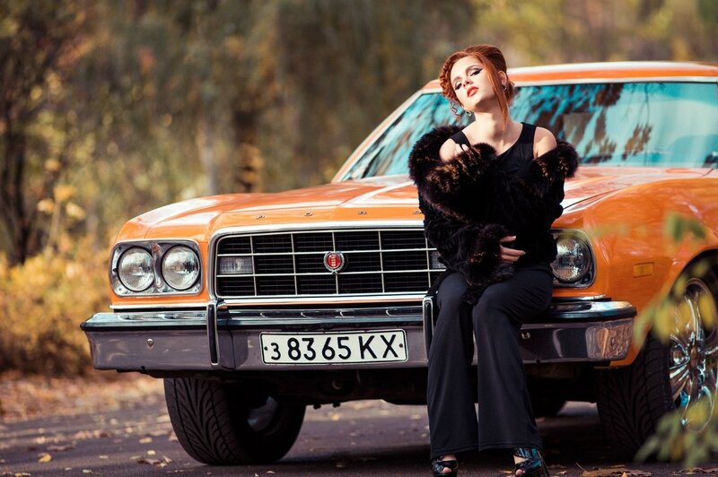 Woman Sitting on Car — Orange, Dramatic, Autumn