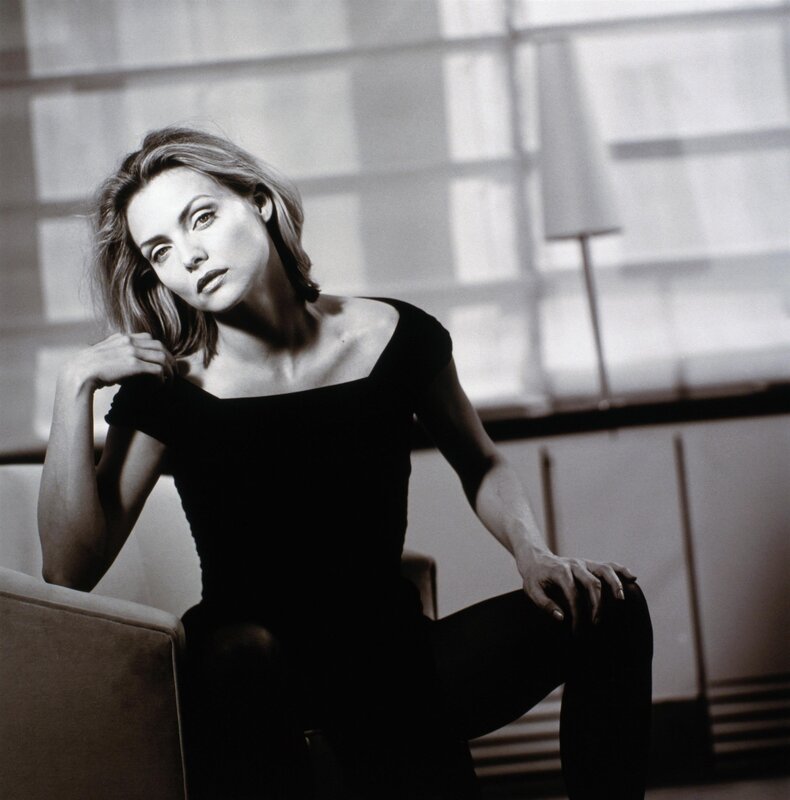 Woman Sitting on Chair — Black, Dramatic, Photograph, Lamp