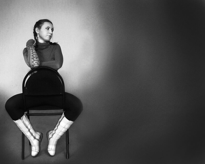 Woman Sitting on Chair — Black, Dramatic, Photograph, Tattoo