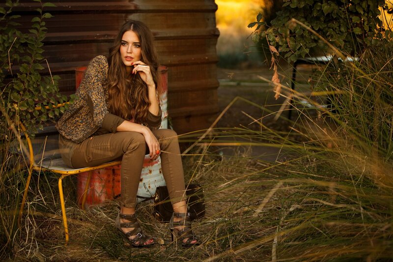 Woman Sitting on Chair — Brown, Dramatic, Sunset