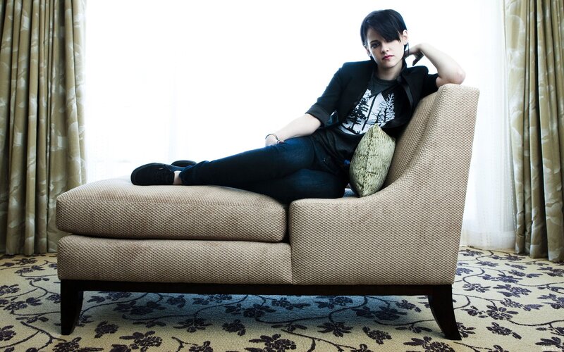 Woman Sitting on Chaise Lounge — Beige