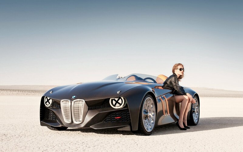 Woman Sitting on Concept Car — Black, Serene