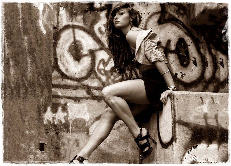 Woman Sitting on Concrete — Brown