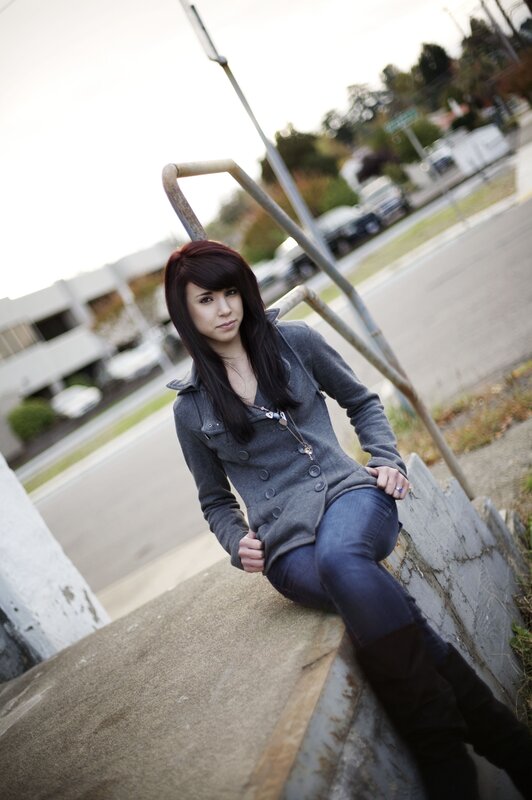 woman sitting on concrete steps