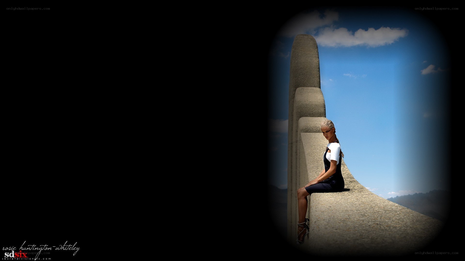 woman sitting on concrete structure