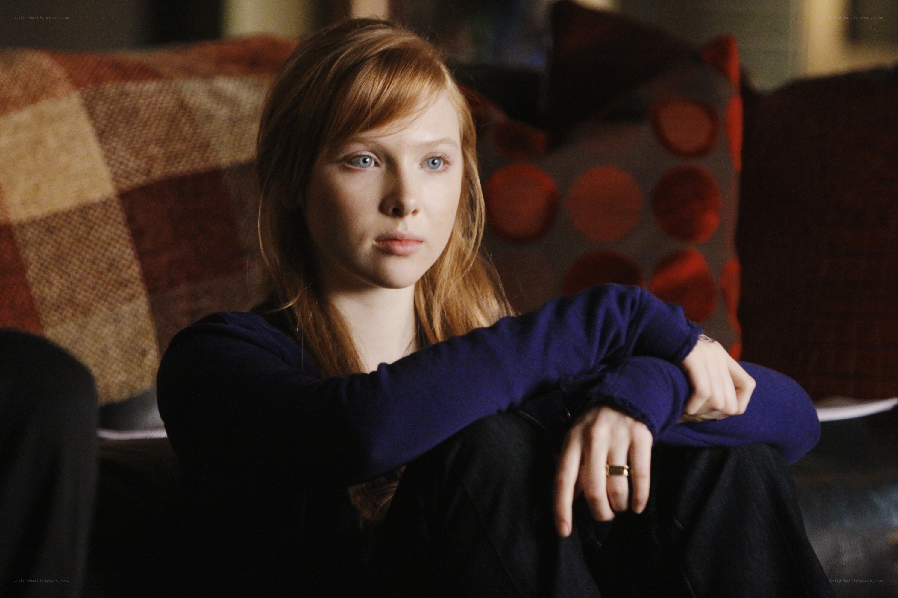 woman sitting on couch