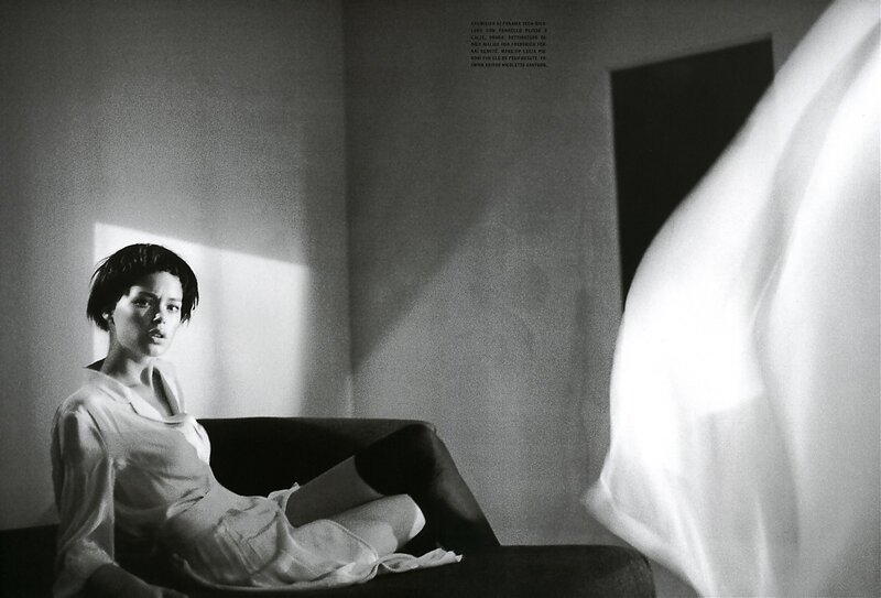 Woman Sitting on Couch — Black, Dramatic, Photograph, Light