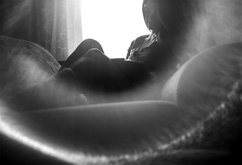 Woman Sitting on Couch — Black, Dramatic, Photograph, Window